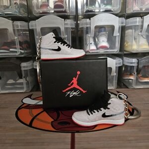 Nike Air Jordan pair of mini sneakers keychain.